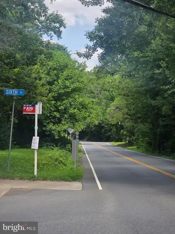 a view of a balcony with wooden floor
