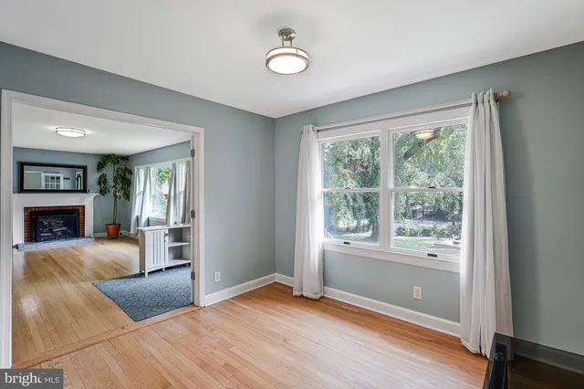a bedroom with furniture and a fireplace
