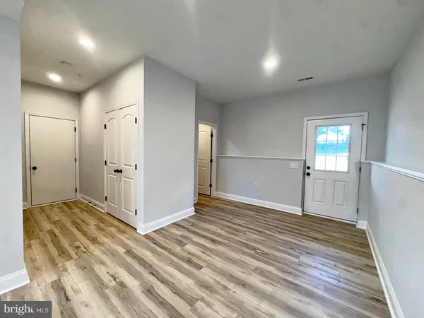 a view of entryway with wooden floor