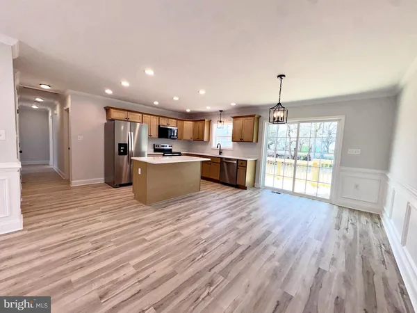 a view of kitchen and wooden floor