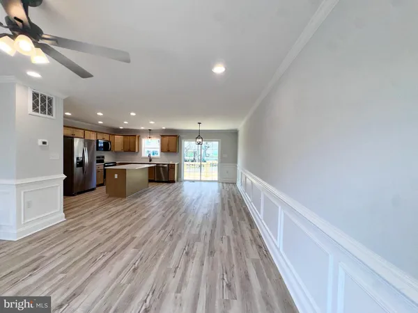 a view of kitchen with wooden floor
