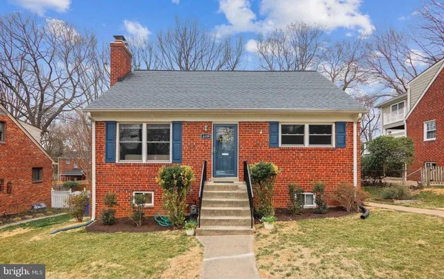 a view of a house with backyard porch and sitting area
