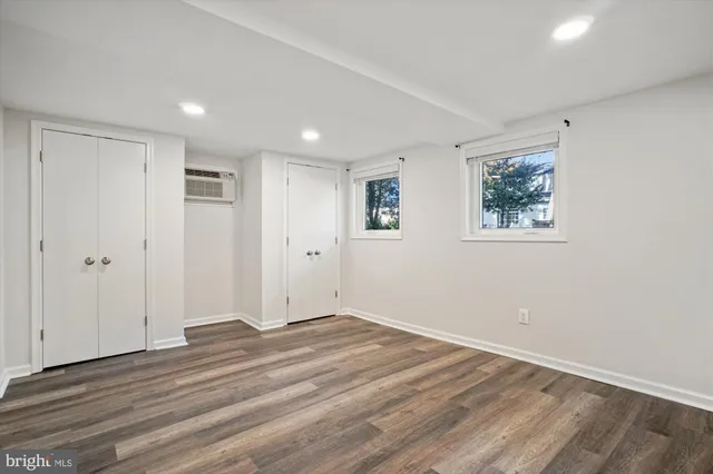a view of room with wooden floor and window