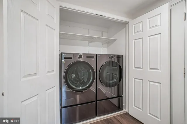 a view of a storage & utility room with washer and dryer