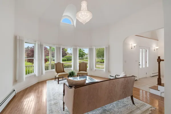 a living room with furniture and a large window