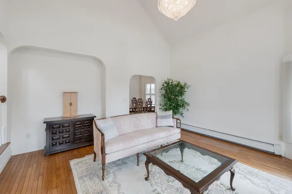 a living room with furniture and a rug