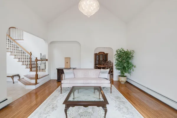 a living room with furniture and a potted plant