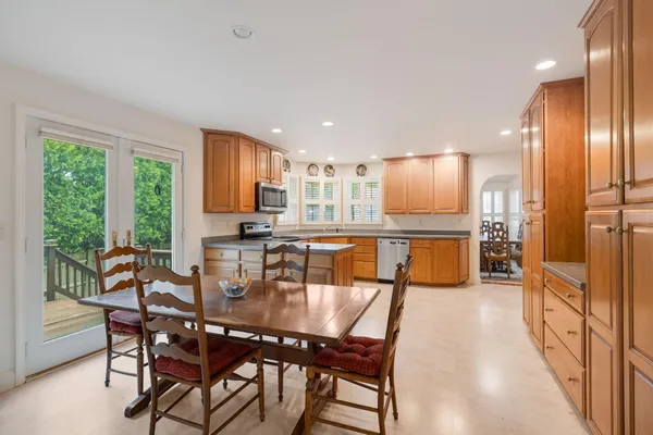 a view of a dining room with furniture window and outside view