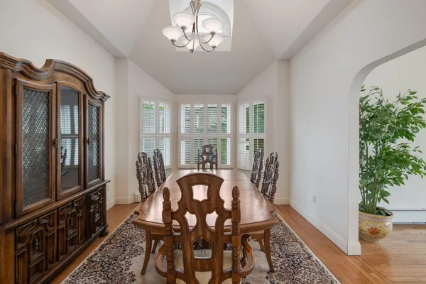 a view of a dining room with furniture window and wooden floor