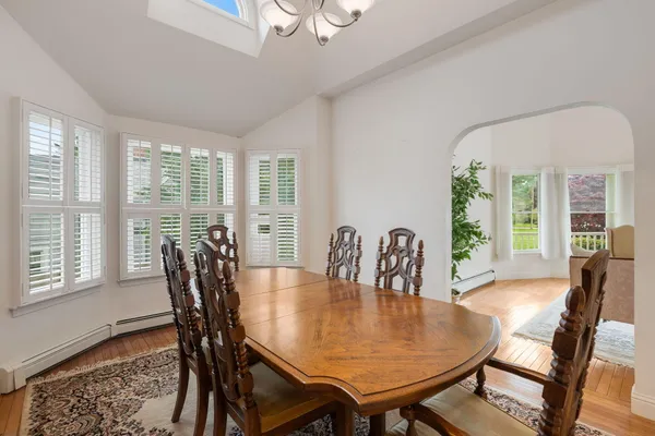a view of a dining room with furniture window and outside view