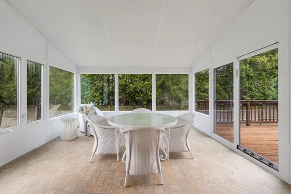 a dining room with furniture and window