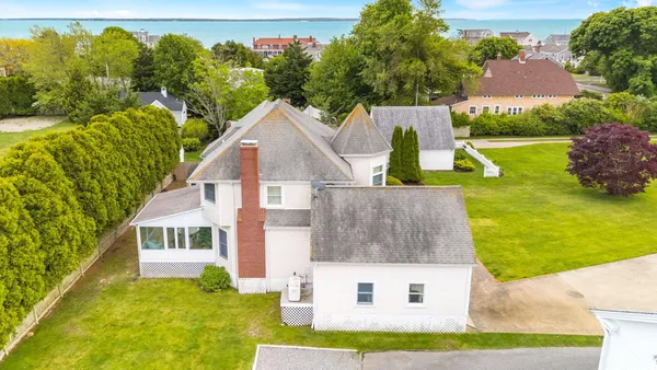 a aerial view of a house with swimming pool garden and patio