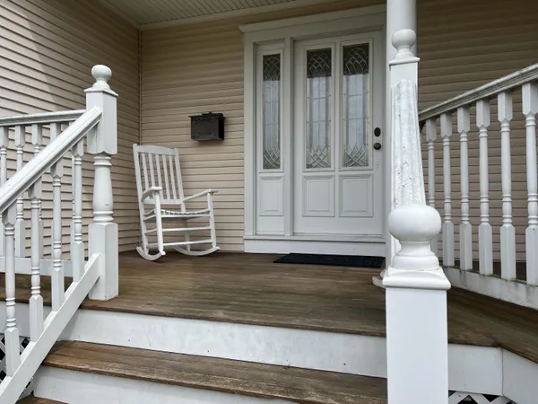 a view of front door and deck