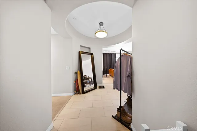 a kitchen with stainless steel appliances granite countertop a stove top oven a sink a dining table and chairs