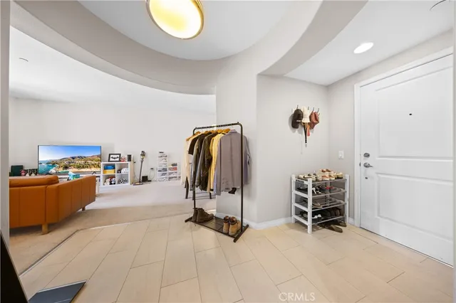 a spacious bathroom with a granite countertop sink and a mirror