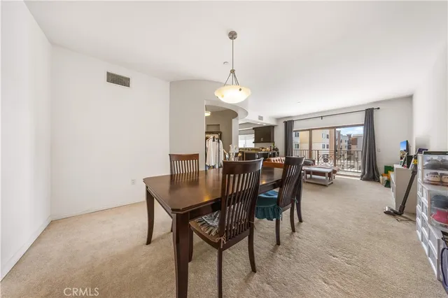 a bedroom with a large bed and a large window
