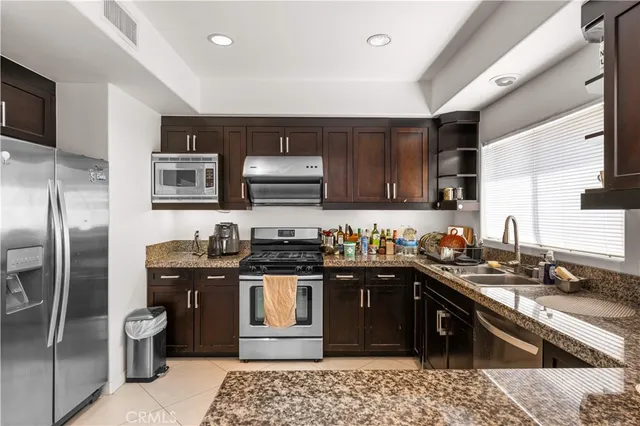 a bed room with a bed and a chair