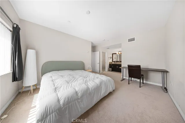 a bedroom with a bed and a closet