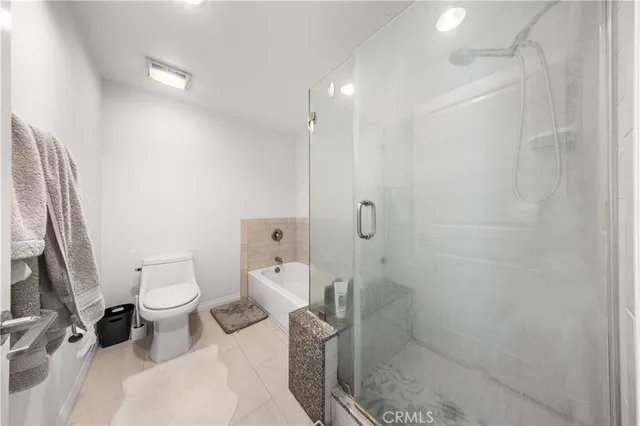 a front view of a building with sitting area