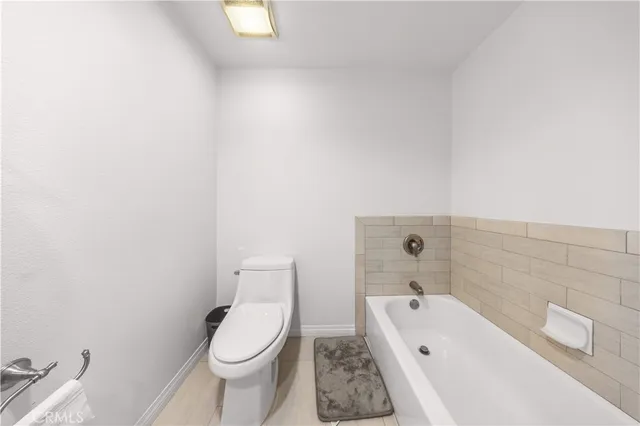 a view of a balcony with chair and table