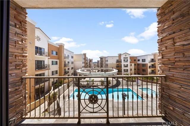 a view of a building with sitting area