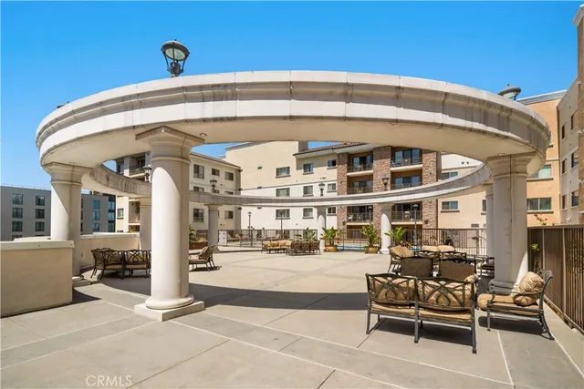 a view of a building with sitting area