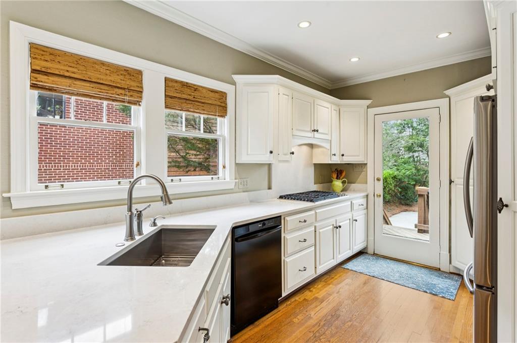 1686 Johnson Road Northeast Atlanta, GA 30306 - Photo 19 of 57 a kitchen with a sink stove and refrigerator