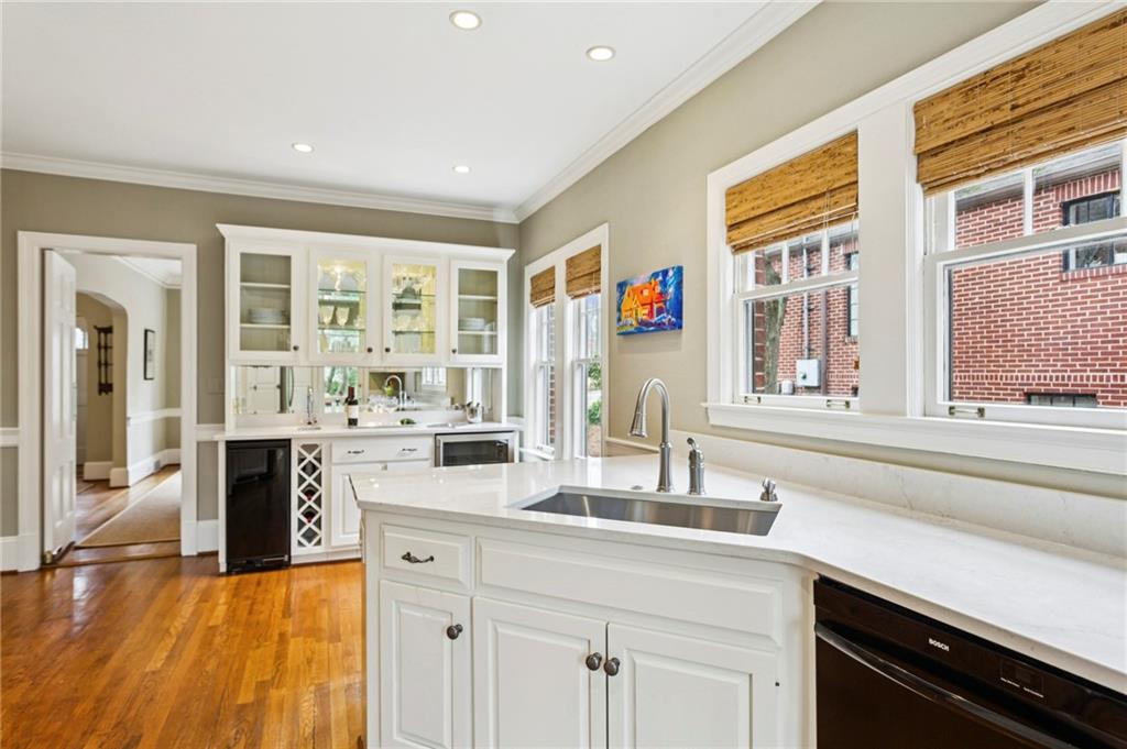 1686 Johnson Road Northeast Atlanta, GA 30306 - Photo 21 of 57 a kitchen with stainless steel appliances granite countertop a stove and a sink