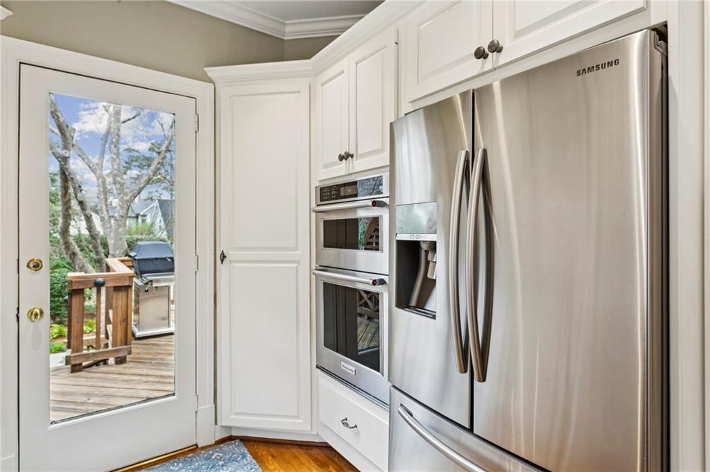 1686 Johnson Road Northeast Atlanta, GA 30306 - Photo 22 of 57 a kitchen with stainless steel appliances a refrigerator and a stove top oven