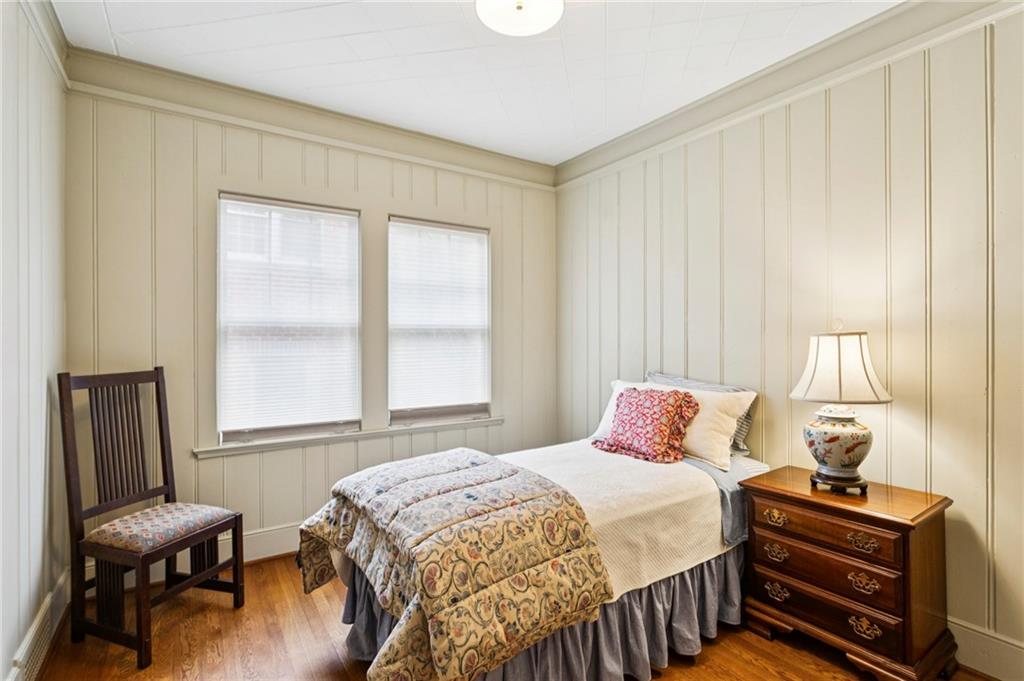 1686 Johnson Road Northeast Atlanta, GA 30306 - Photo 25 of 57 a bedroom with a bed a chair and next to a window