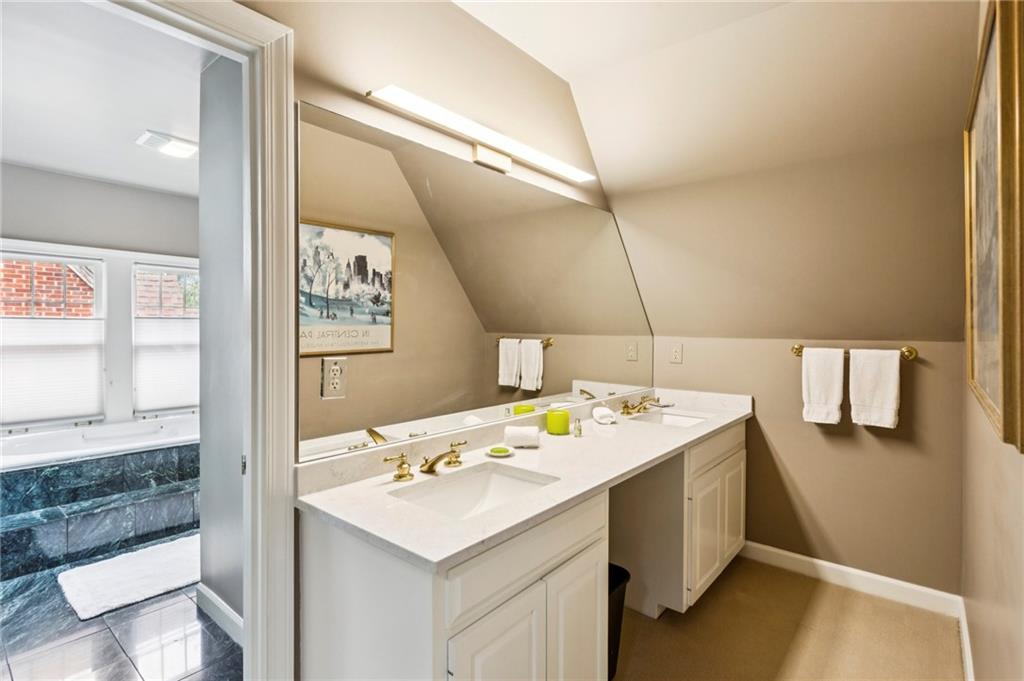 1686 Johnson Road Northeast Atlanta, GA 30306 - Photo 34 of 57 a bathroom with a sink a vanity and a mirror