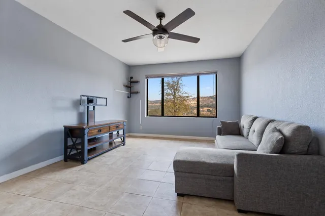 a living room with furniture and a window