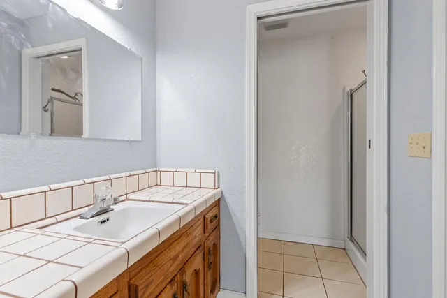 a bathroom with a sink and a mirror