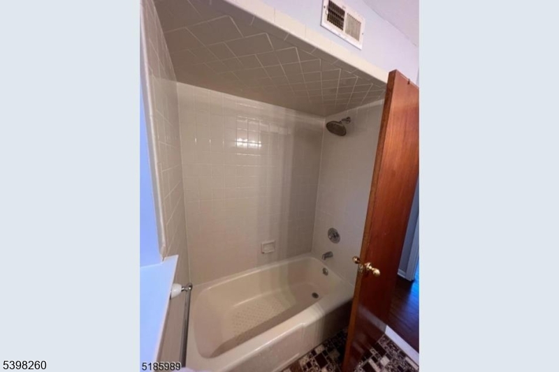 736 William Street Harrison, NJ 07029 - Photo 7 of 10 a bathroom with a bathtub