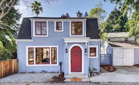a front view of a house with yard