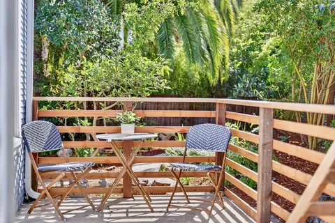 a view of balcony with outdoor seating and plants