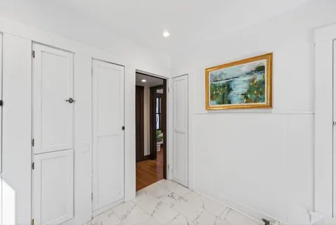 a view of a hallway with closet
