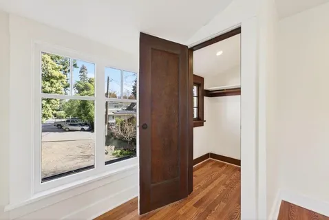 a view of walk in closet with living room