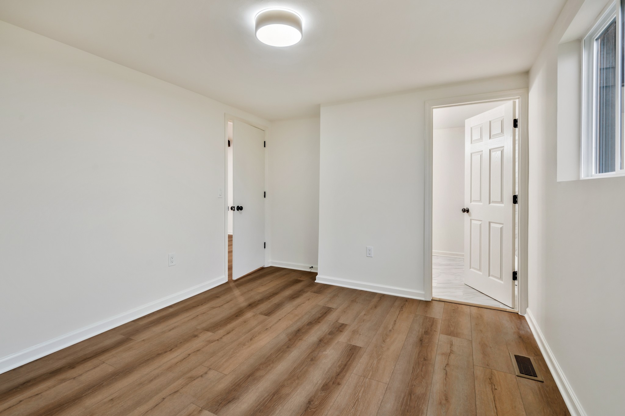 1421 Mohawk Trail Madison, TN 37115 - Photo 17 of 28 a view of an empty room with wooden floor