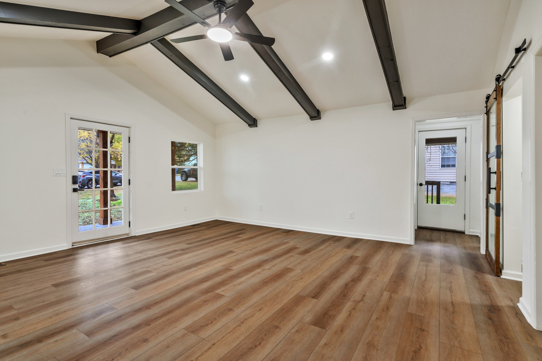 1421 Mohawk Trail Madison, TN 37115 - Photo 10 of 28 wooden floor in an empty room with a window