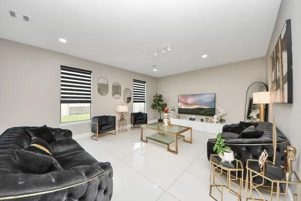 a living room with furniture and fireplace