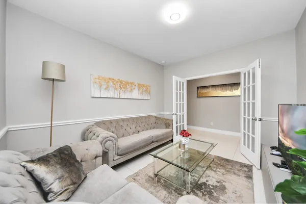 a living room with furniture and a table