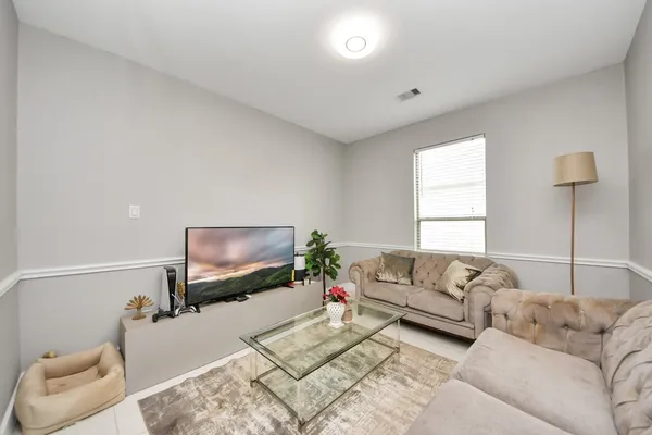 a living room with a couch and a flat screen tv