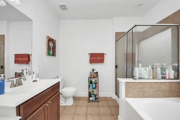 a bathroom with a sink a mirror and a toilet