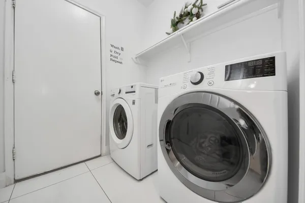 a utility room with dryer and washer