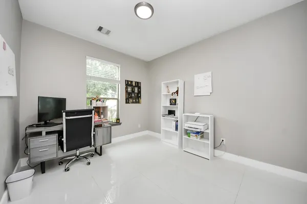 a view of workspace with furniture and a window