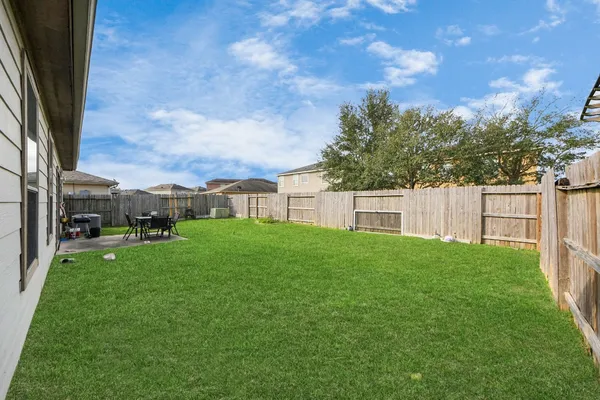 a view of a house with a back yard