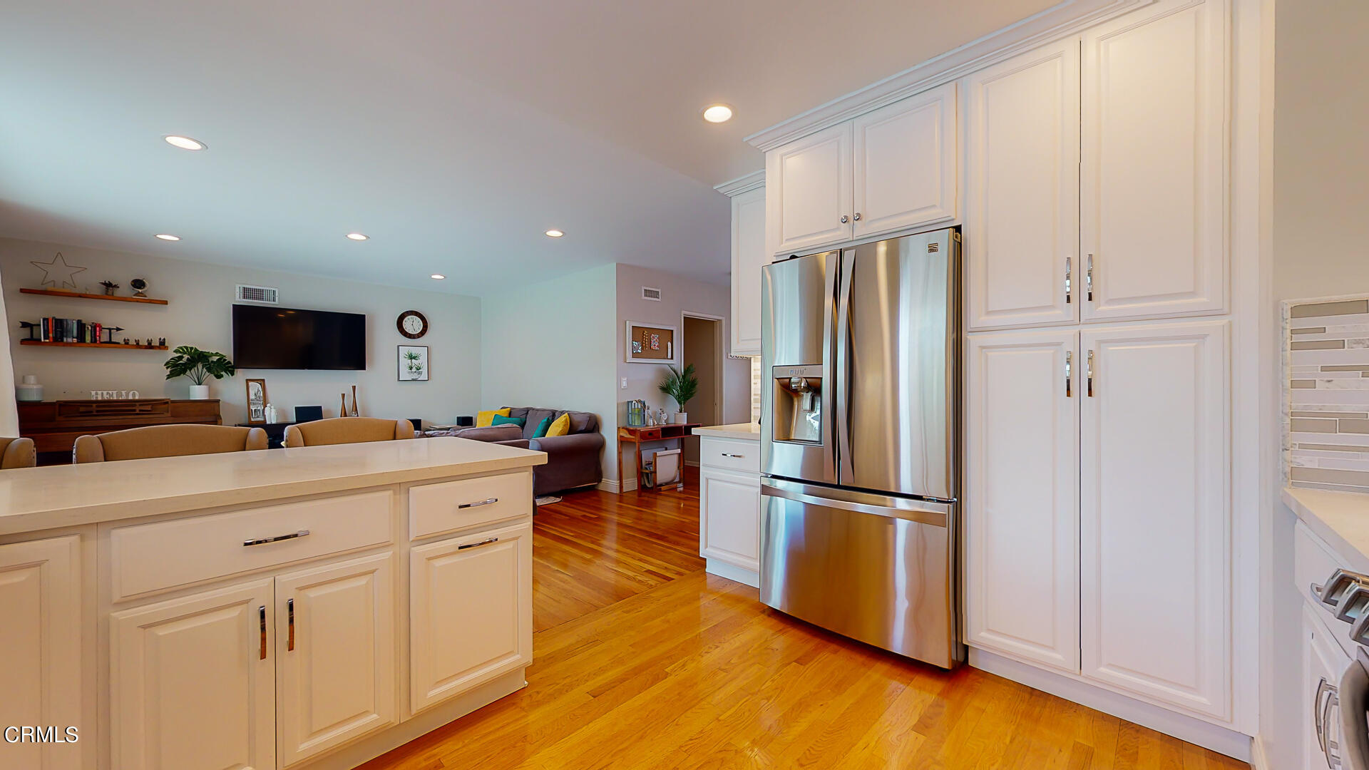 11052 Corley Drive Whittier, CA 90604 - Photo 13 of 39 a kitchen with stainless steel appliances a refrigerator sink and cabinets