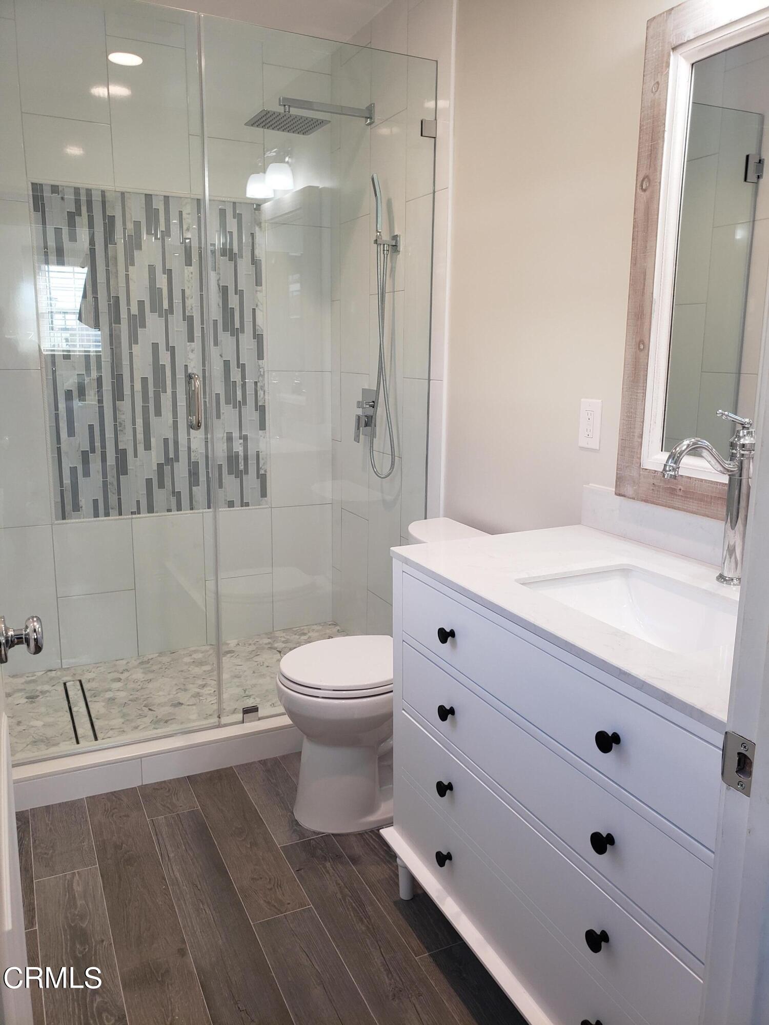 11052 Corley Drive Whittier, CA 90604 - Photo 18 of 39 a bathroom with a sink a toilet and shower