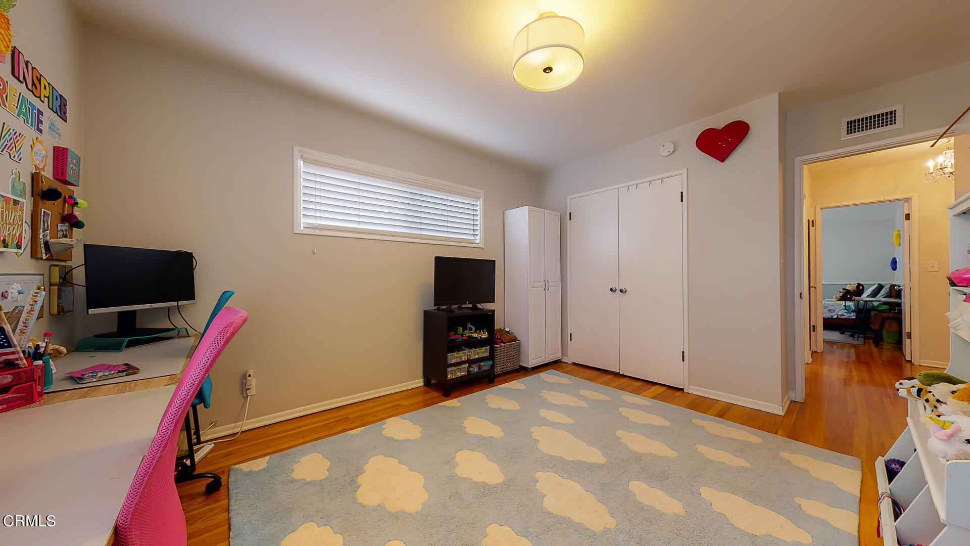 11052 Corley Drive Whittier, CA 90604 - Photo 27 of 39 a bedroom with a bed and a flat screen tv